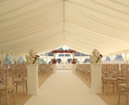 Luxury-draped-event-tent-solution-accommodating-complex-cultural-wedding-decor-and-aisle-arrangements