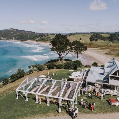 rambo-estrada-clear-marquee-orua-beach-house-coromandel-wooden-funriture-twelve-tables-creative-event-hire-nz
